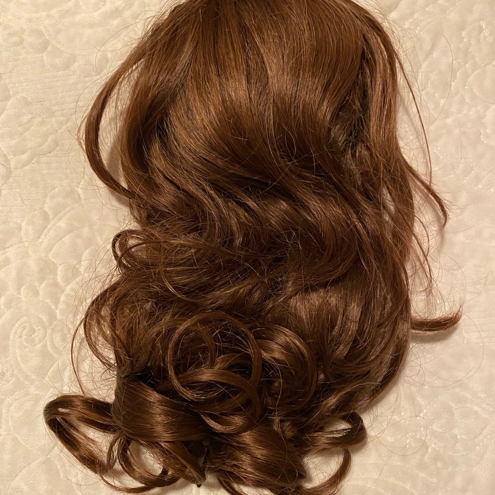 14” new, never worn fake pony brown.